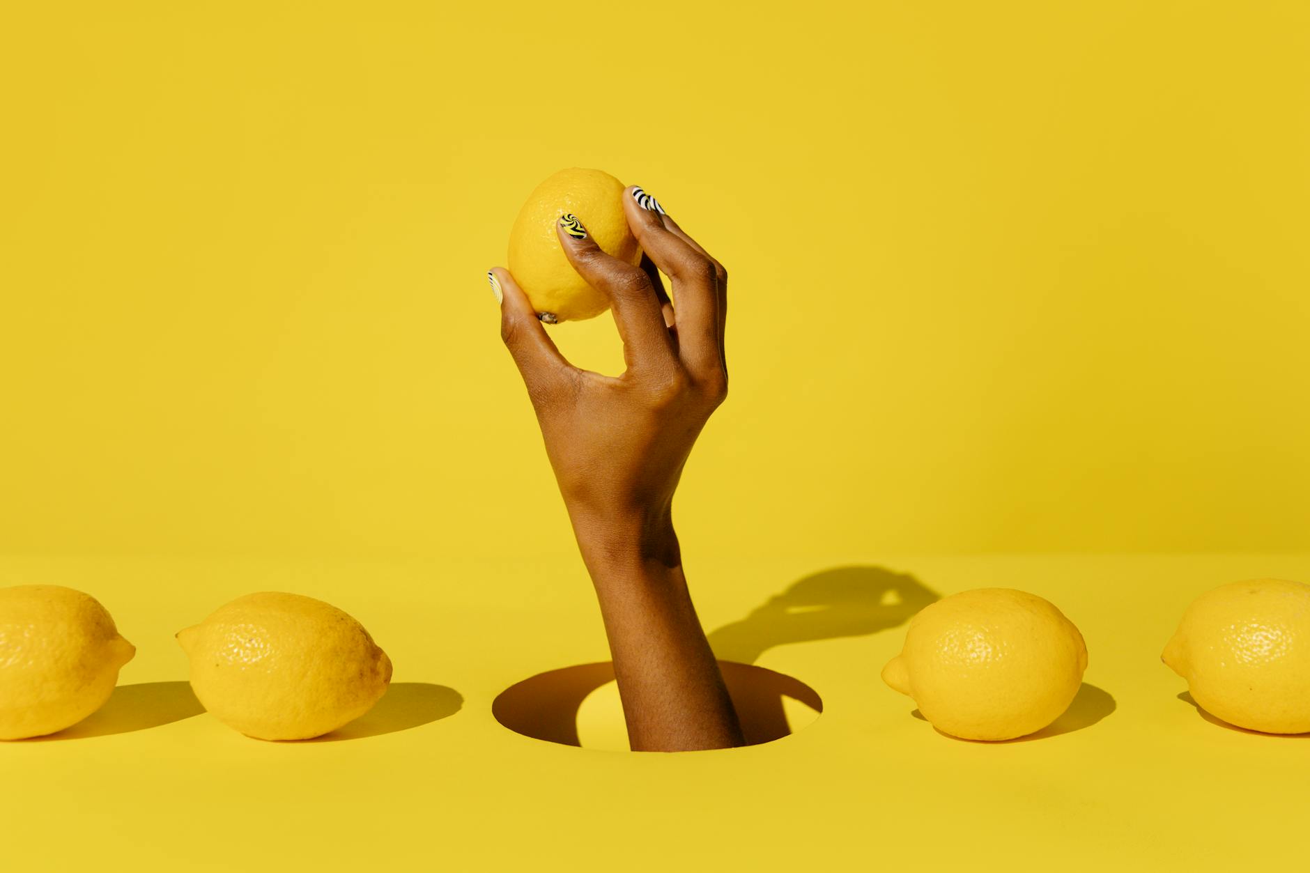 A vibrator surrounded by fresh lemons, symbolizing renewal and healing in intimate reconnection.