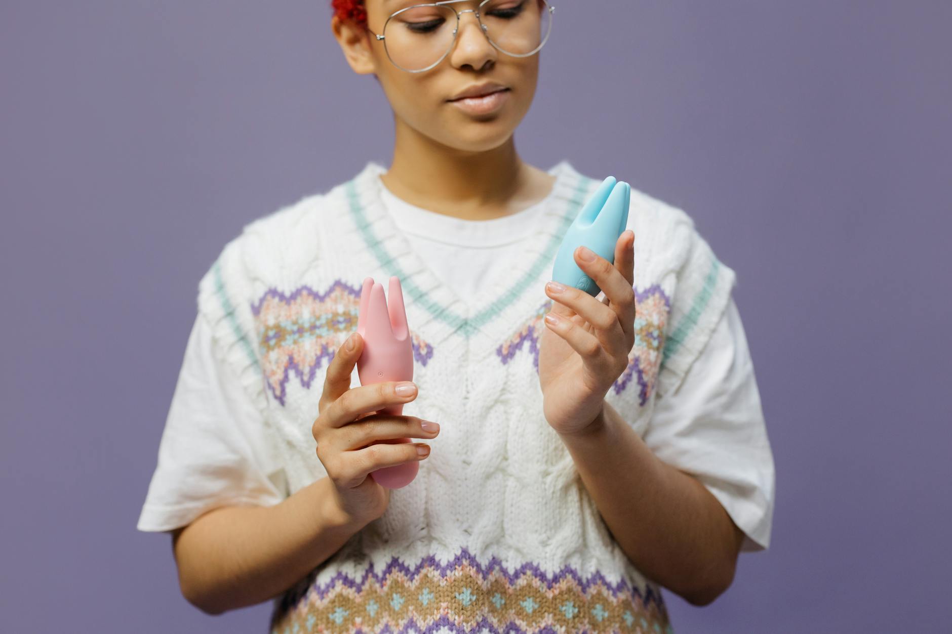 Woman holding lemon vibrators, exploring reconnection to pleasure after recovery from depression
